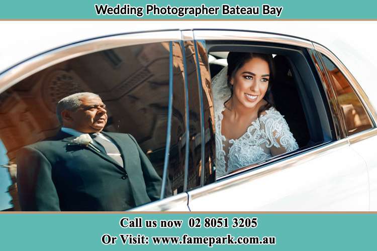 Photo of the Bride inside the bridal car and her father standing outside Bateau Bay NSW 2261