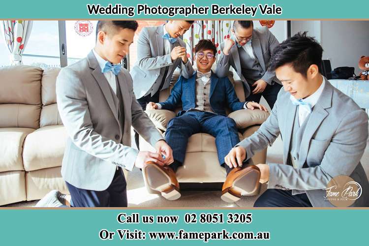 Photo of the Groom helping by the groomsmen getting ready Berkeley Vale NSW 2261