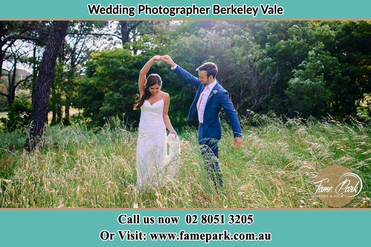 Photo of the Groom and the Bride dancing on the fields Berkeley Vale