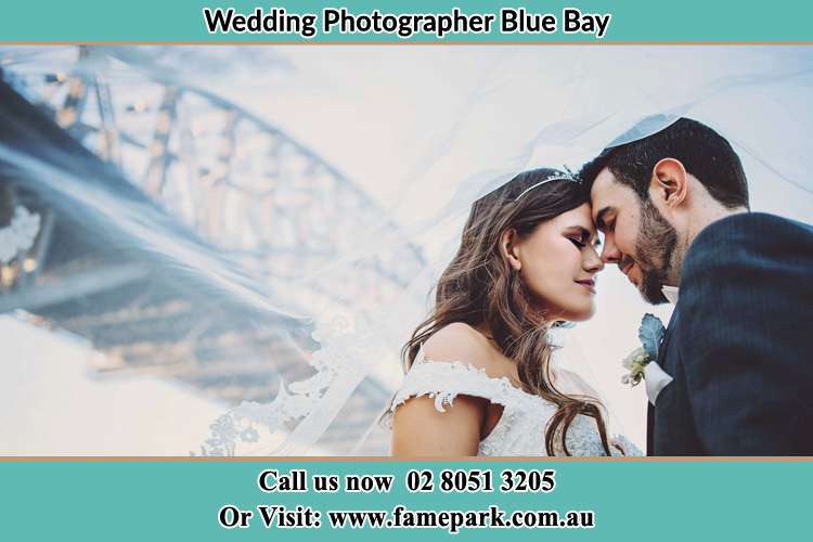 Close up photo of the Bride and the Groom under the bridge Blue Bay NSW 2261