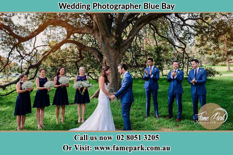 Photo of bride and groom with their entourage Blue Bay