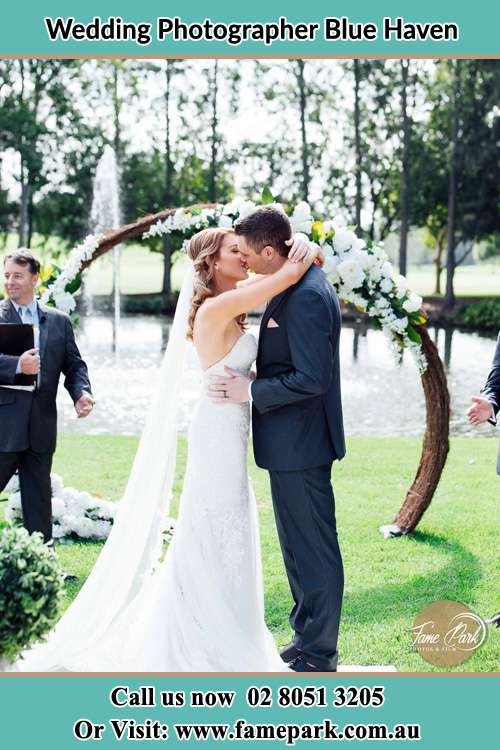 Photo of the Bride and the Groom kissing ceremony at the garden wedding Blue Haven NSW 2262