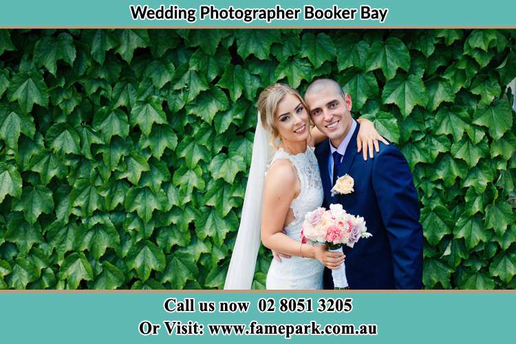 The Bride and the Groom happily pose for the camera Booker Bay