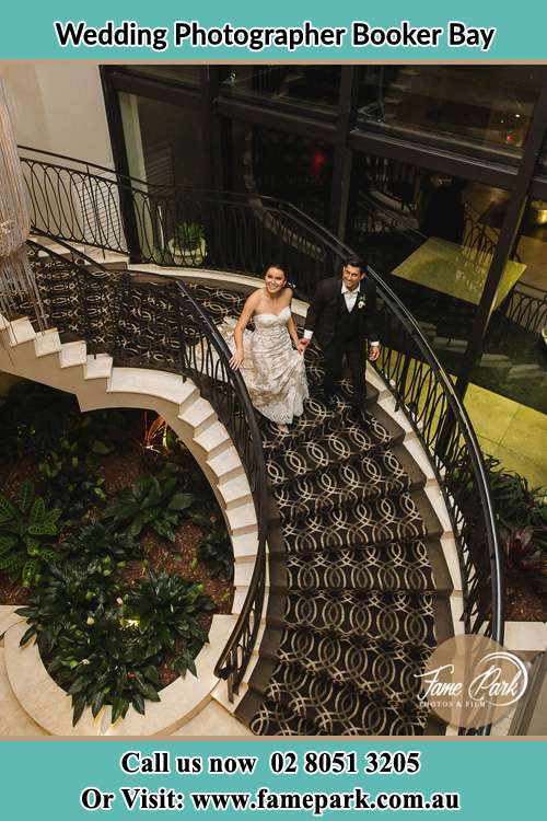 Photo of the Bride and Groom going down the stairs Booker Bay