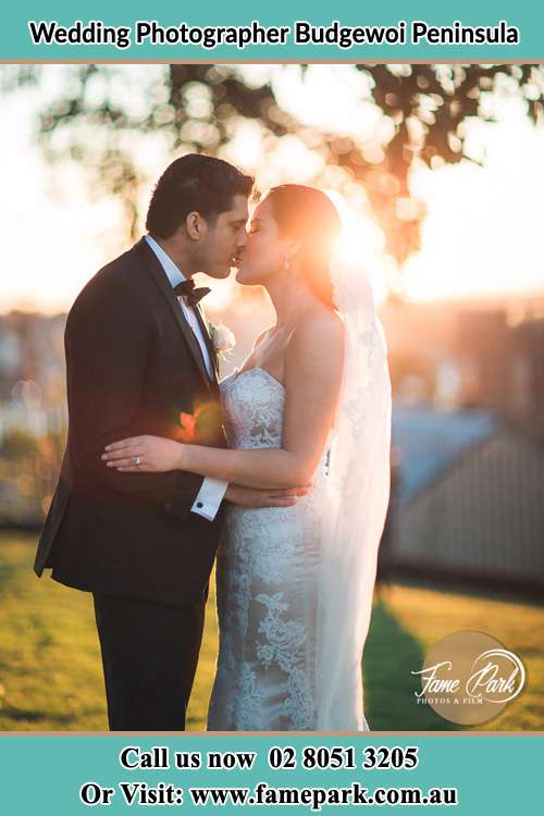 The Groom and the Bride Kissing before a sunset Budgewoi Peninsula