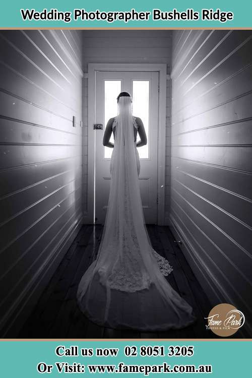 Photo of the Bride waiting for her wedding behind a closed door Bushells Ridge