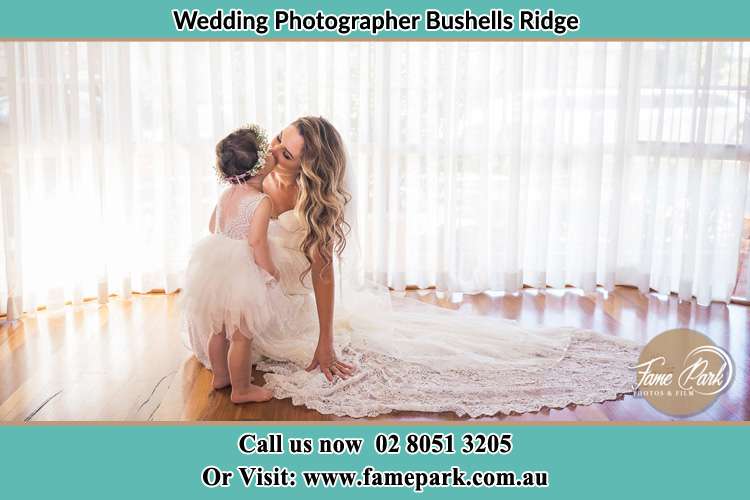 Photo of the Bride kissing her loving flower girl Bushells Ridge