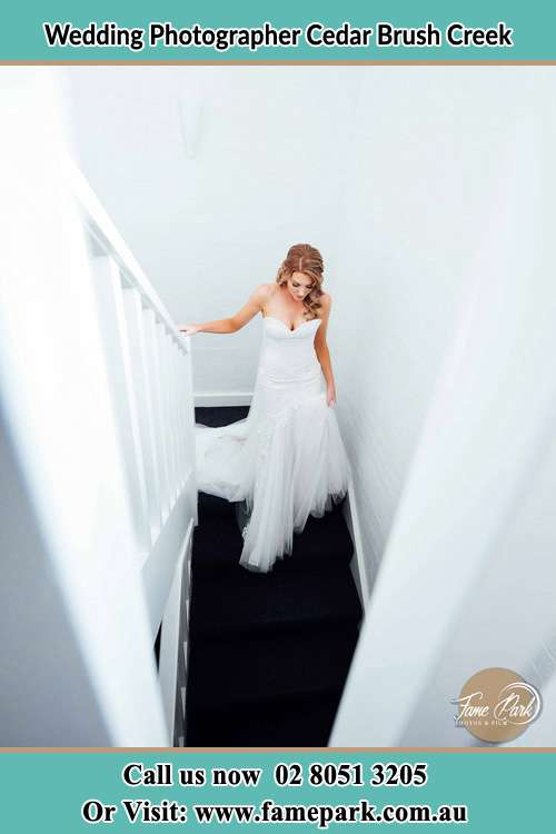 Photo of the Bride going down the stair Cedar Brush Creek NSW 2259