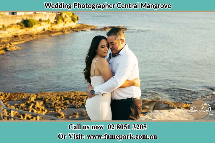 Photo of the Bride and the Groom hugging near the lake Central Mangrove NSW 2250