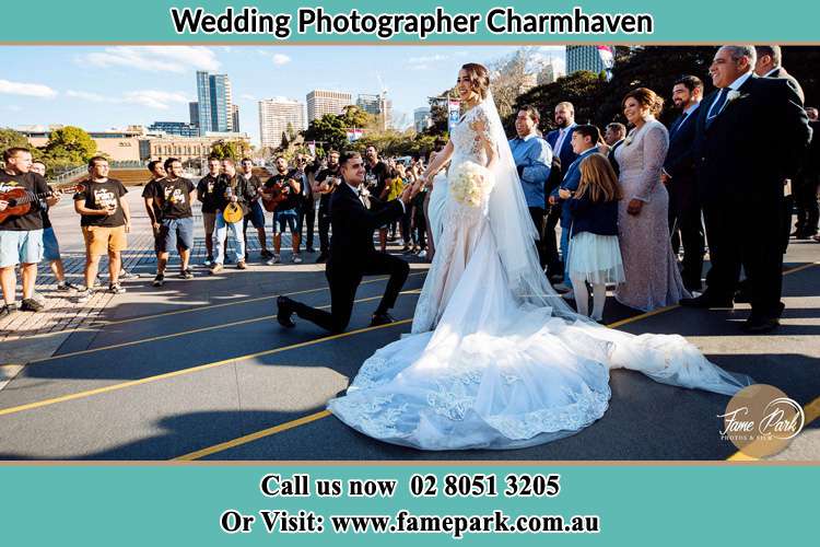 Groom Kneeling down in front of the Bride Charmhaven NSW 2263