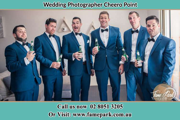 The groom and his groomsmen striking a wacky pose in front of the camera Cheero Point NSW 2083