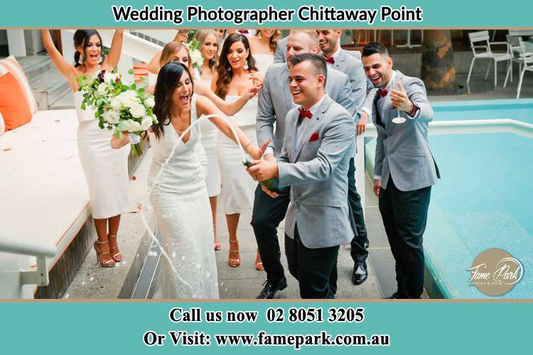 Photo of the Groom and the Bride celebrating with the secondary sponsors Chittaway Point NSW 2261