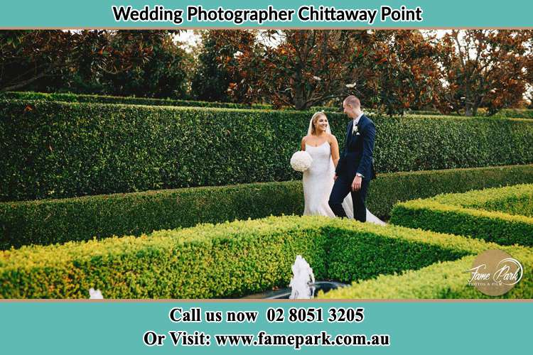 Photo of the Bride and the Groom walking at the garden Chittaway Point NSW 2261