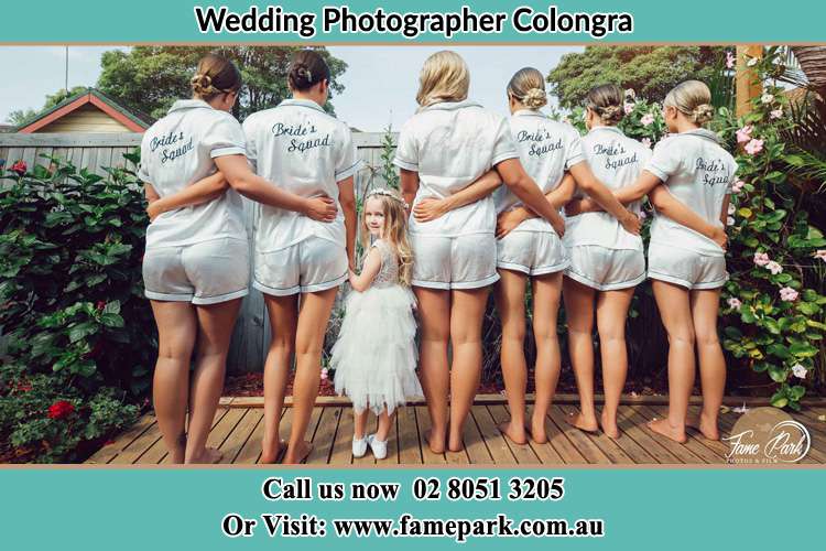 Behind photo of the Bride and the bridesmaids with the flower girl looking back Colongra NSW 2262