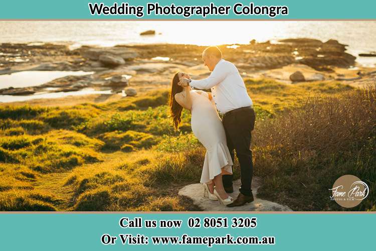 Photo of the Bride and the Groom dancing near the lake Copacabana NSW 2251