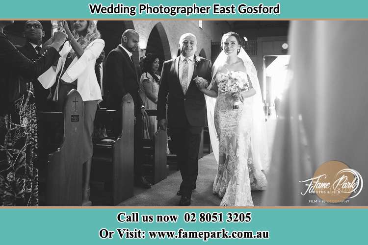 Photo of the Bride with her father walking down the aisle East Gosford