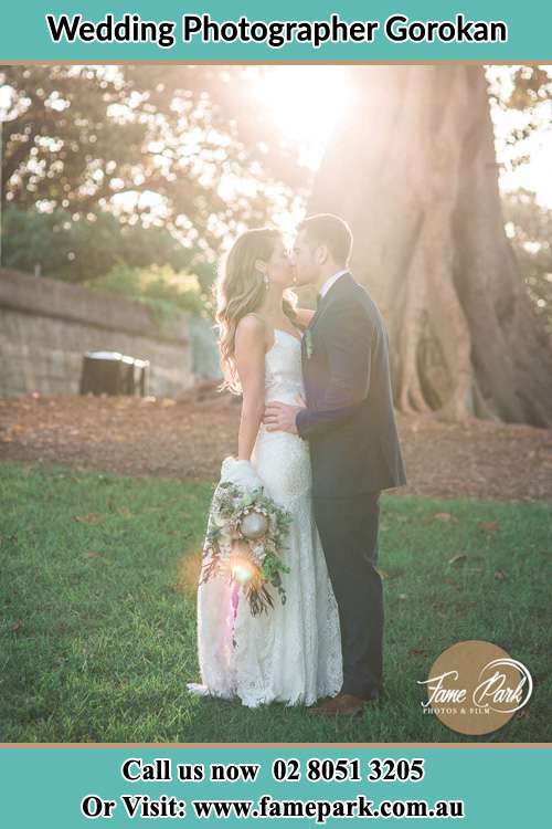 Photo of the Bride and the Groom kissing at the yard Gorokan NSW 2263