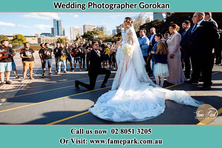 Groom Kneeling down in front of the Bride Gorokan NSW 2263