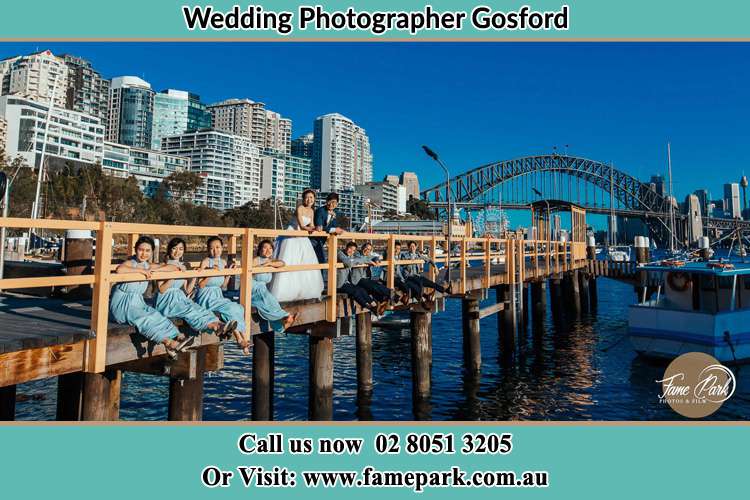 Bride , Groom and their secondary sponsors at bridge Gosford