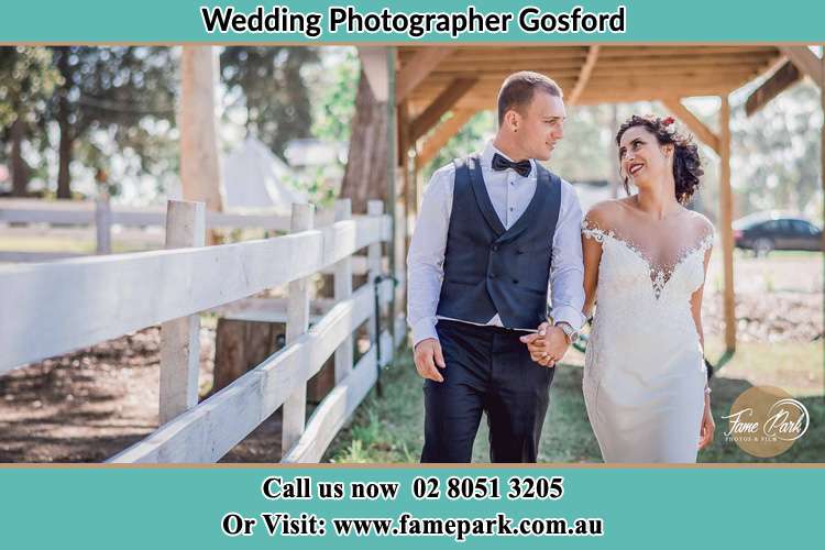 Photo of the Groom and the Bride holding hands while walking Gosford NSW 2250