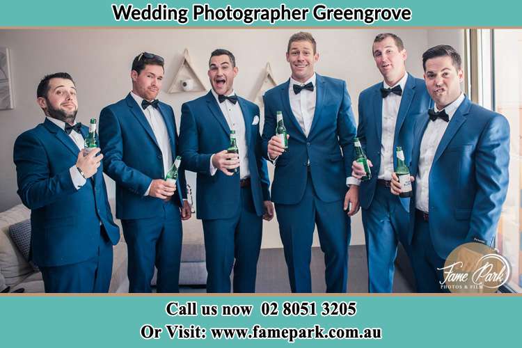 The groom and his groomsmen striking a wacky pose in front of the camera Greengrove NSW 2250