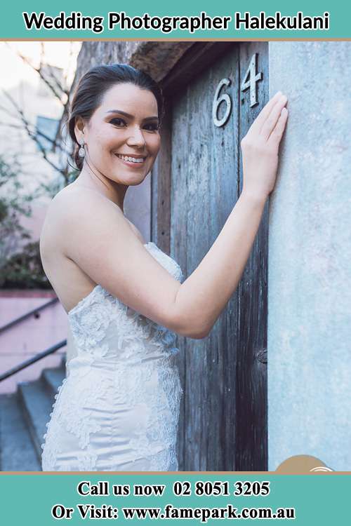 The Bride smiling at the front door Halekulani