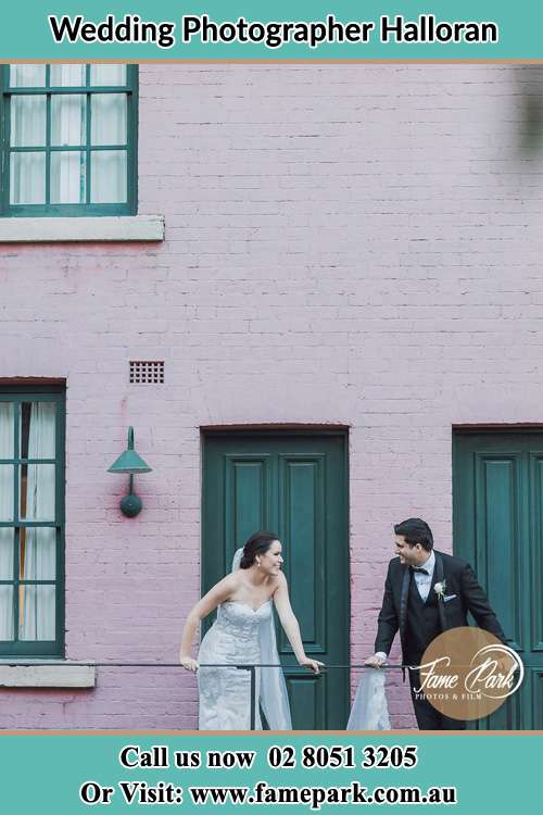 Photo of the Bride and the Groom looking each other at the balcony Halloran NSW 2259