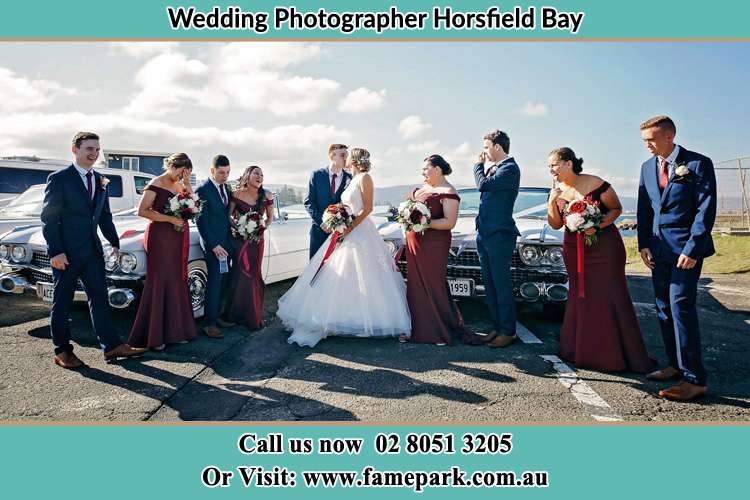 The entourage watch as the new couple kiss Horsfield Bay