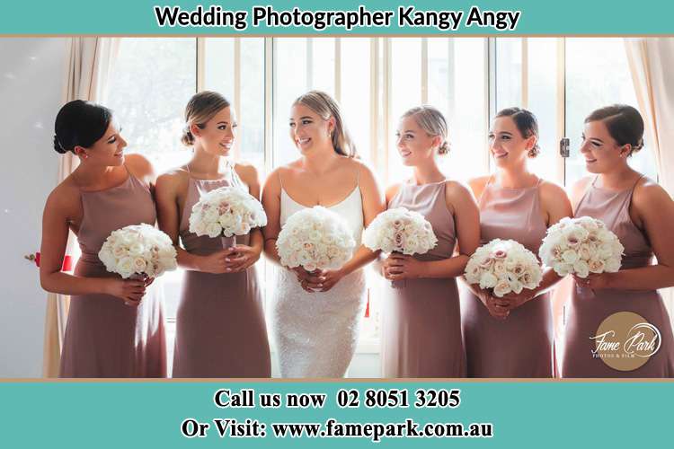 Photo of the Bride and the bridesmaids holding flower bouquet Kangy Angy NSW 2258