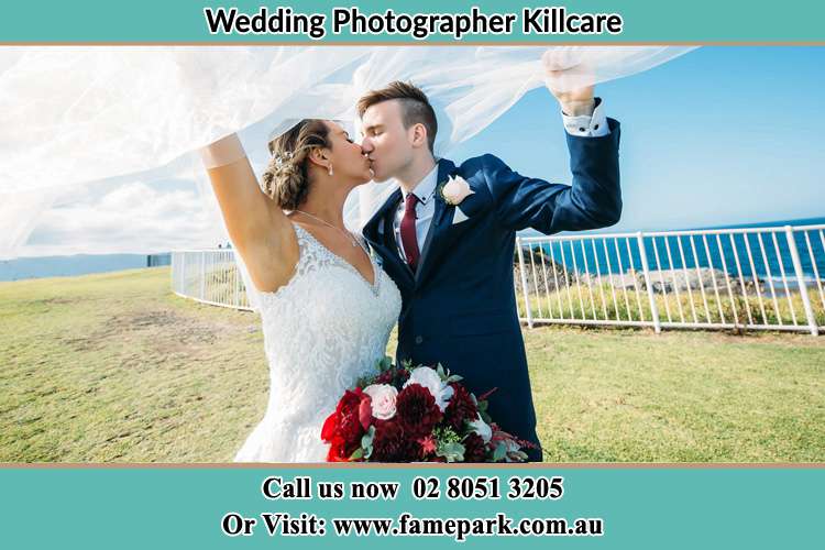 Photo of the Bride and the Groom kissing at the yard Killcare NSW 2257