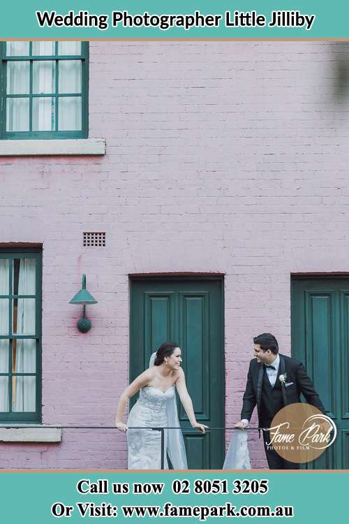 Photo of the Bride and the Groom looking each other at the balcony Little Jilliby NSW 2259