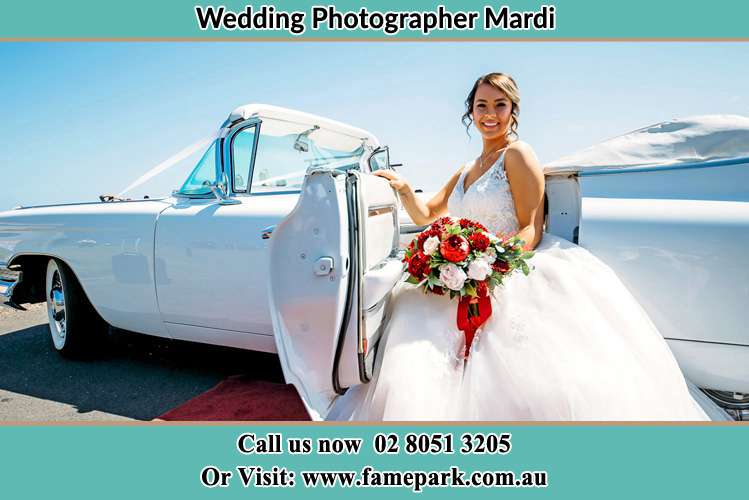 Photo of the Bride outside the bridal car Mardi NSW 2259