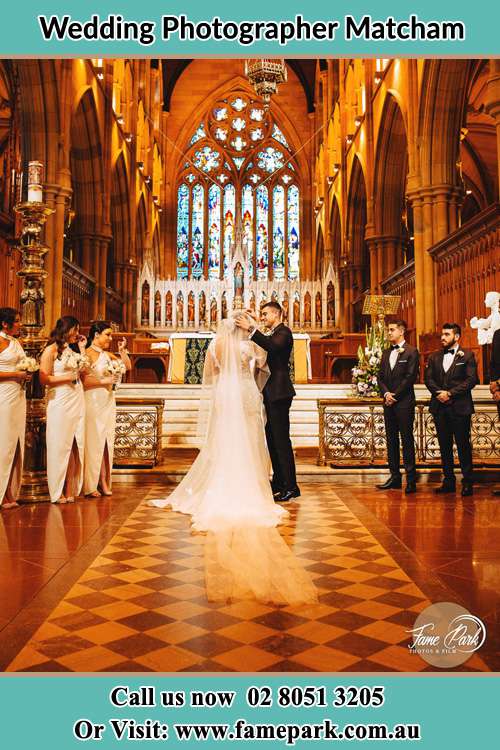 Photo of the Groom and the Bride with the entourage at the altar Matcham NSW 2250