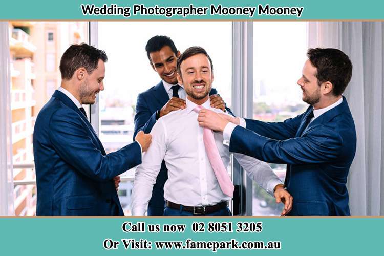 Photo of the Groom helping by the groomsmen getting ready Mooney Mooney NSW 2083