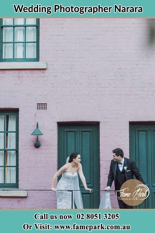 Photo of the Bride and the Groom looking each other at the balcony Narara NSW 2250