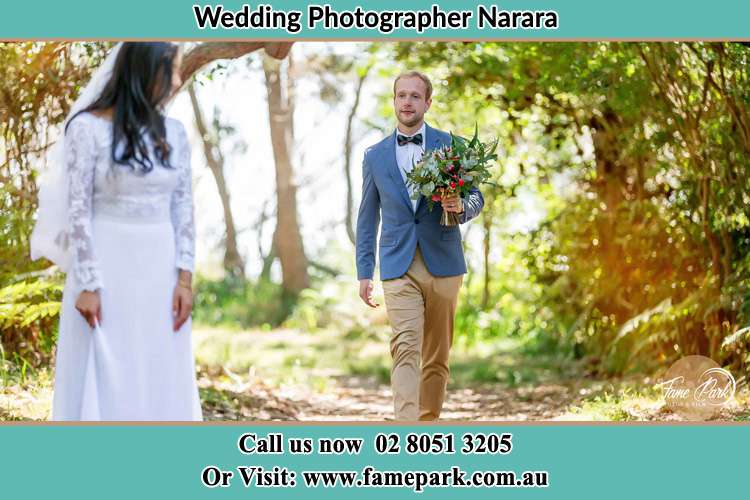 Photo of the Groom bringing flower to the Bride Narara NSW 2250