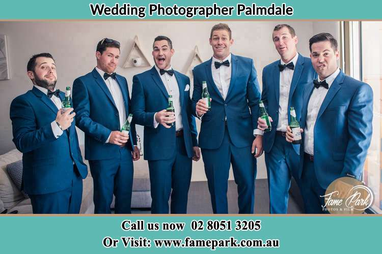 The groom and his groomsmen striking a wacky pose in front of the camera Palmdale NSW 2258