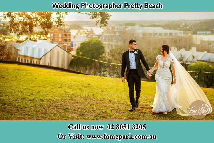 Photo of the Groom and the Bride walking at the yard Pretty Beach NSW 2257