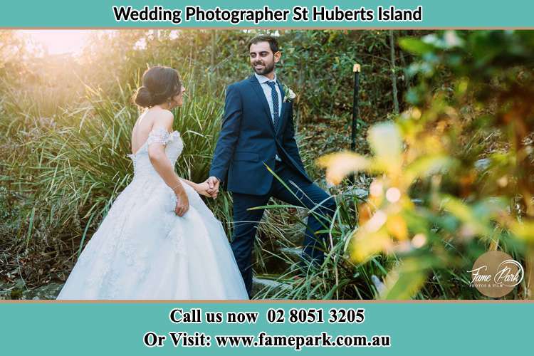 Photo of the Bride and the Groom going up the hill St Huberts Island NSW 2257