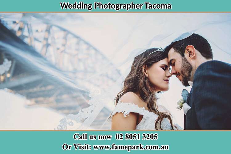 Close up photo of the Bride and the Groom under the bridge Tacoma NSW 2259