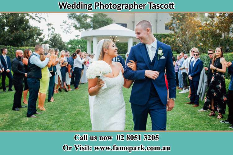 Photo of the Bride and the Groom looking each other while walking Tascott NSW 2250