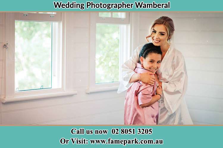 Photo of the Bride hugging the flower girl Wamberal NSW 2260