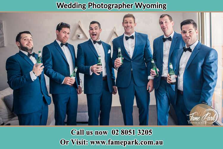 The groom and his groomsmen striking a wacky pose in front of the camera Wyoming NSW 2250