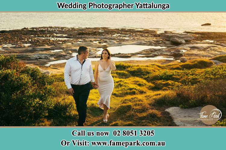 Bride and Groom walks near the shore Yattalunga